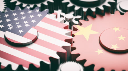 US and China flags depicted on interlocking gears