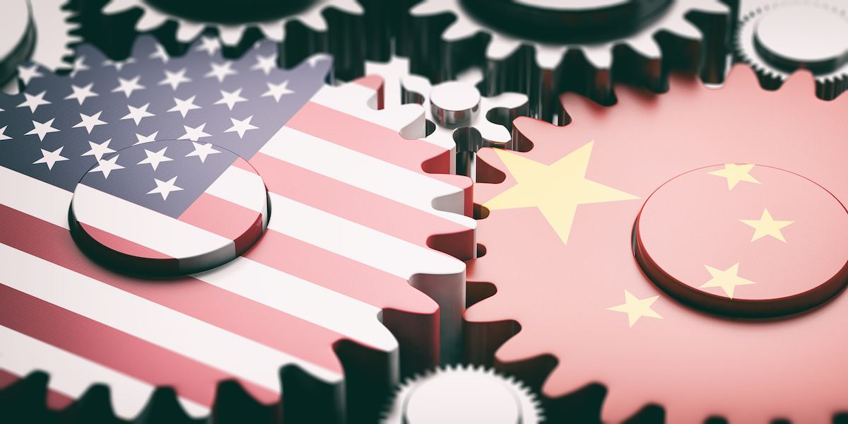 US and China flags depicted on interlocking gears