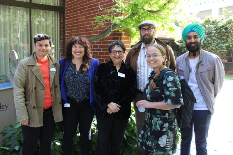 Dean Raka Ray (center) with staff from the D-Lab