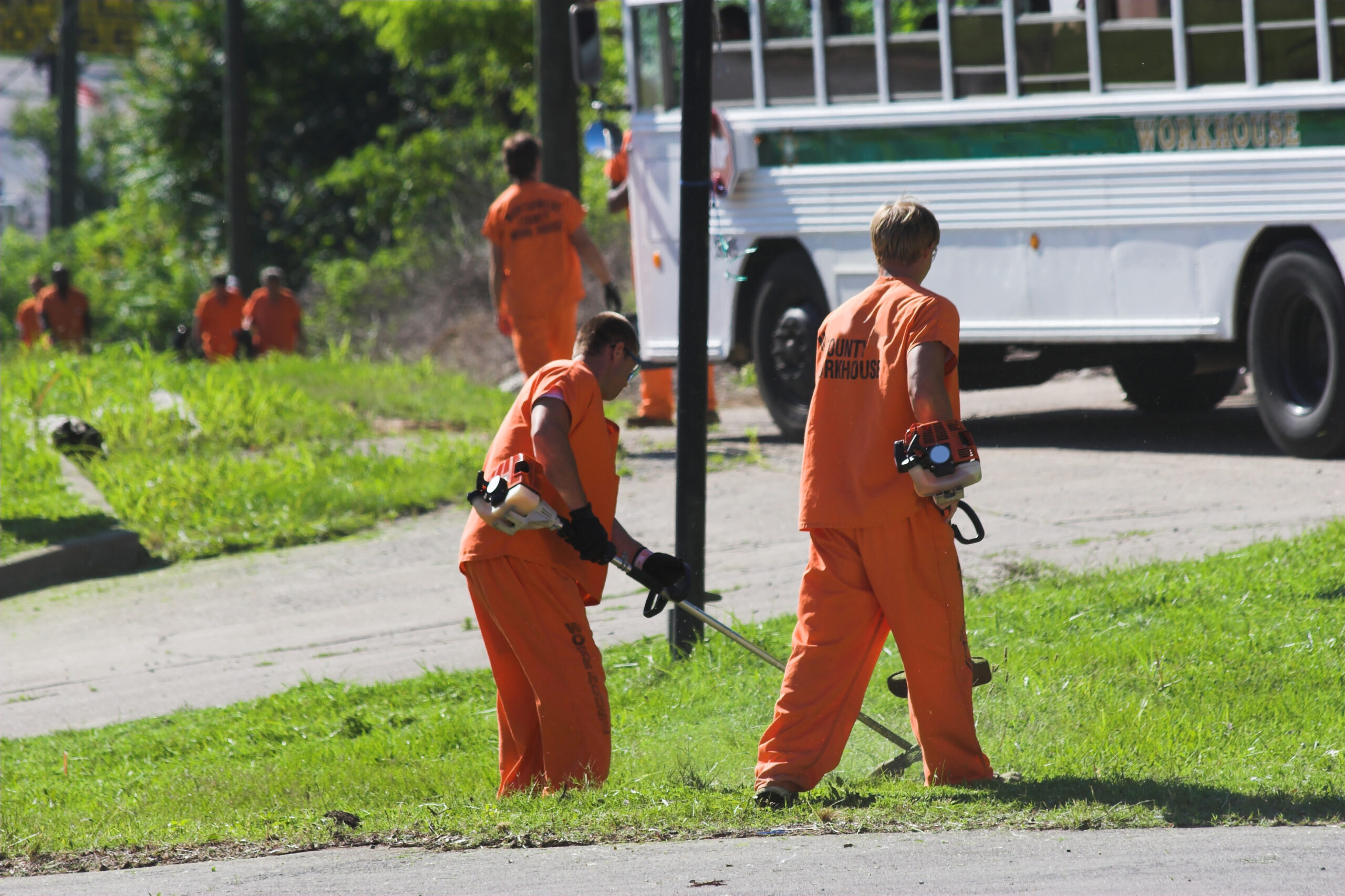 Prisoners out doing weed eating and litter pickup along side roadway