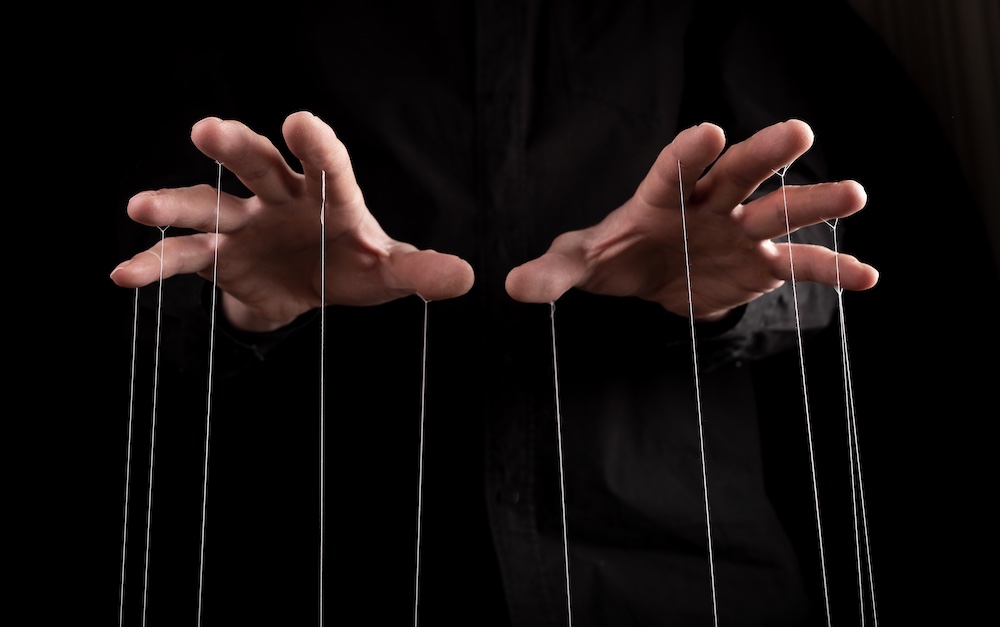 Man hands with strings on fingers. Manipulation, negative influence or addiction concept. High quality photo
